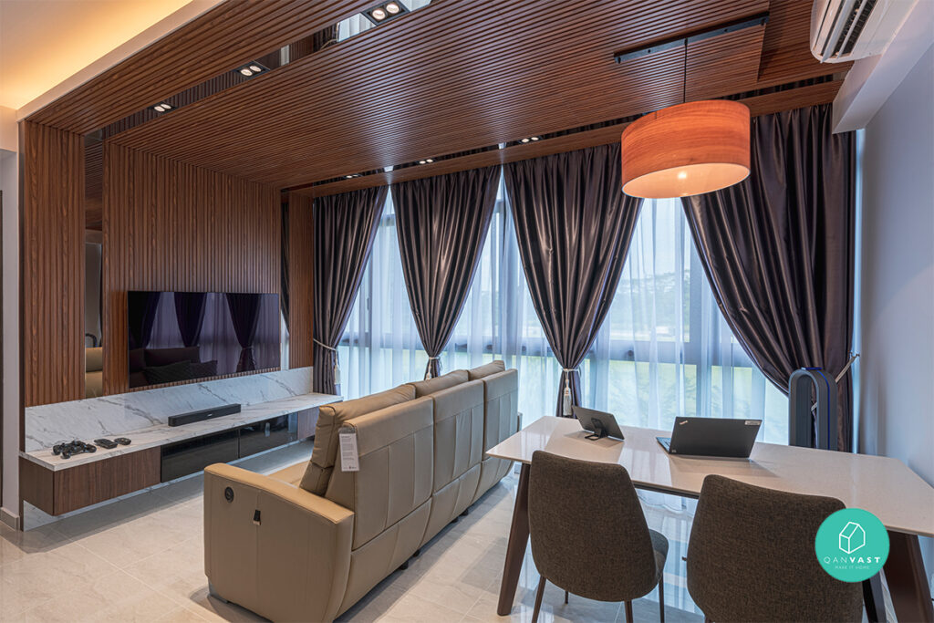 Cozy living room and dining area illuminated by warm orange lamps and recessed tread lighting, creating a welcoming and inviting atmosphere with a focus on ambiance and functionality.