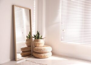 Large stylish mirror in room, space for text. Element of interior design