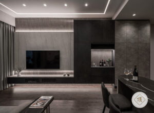 A modern living room with a wall-mounted TV, sleek cabinetry, a bar area with wine bottles, and a contemporary design featuring dark tones and ambient lighting.