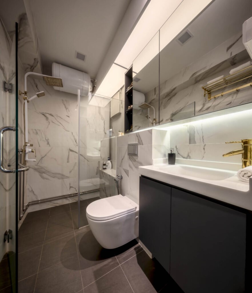 Bright common bathroom with white marble-look tiles, wall-hung WC and backlit mirror cabinet in an HDB renovation