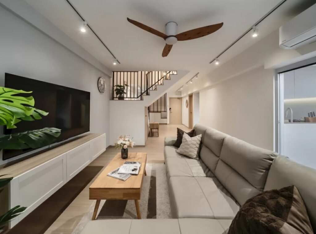 Contemporary living room by Zenith Arc in Singapore featuring soft furnishings and warm lighting