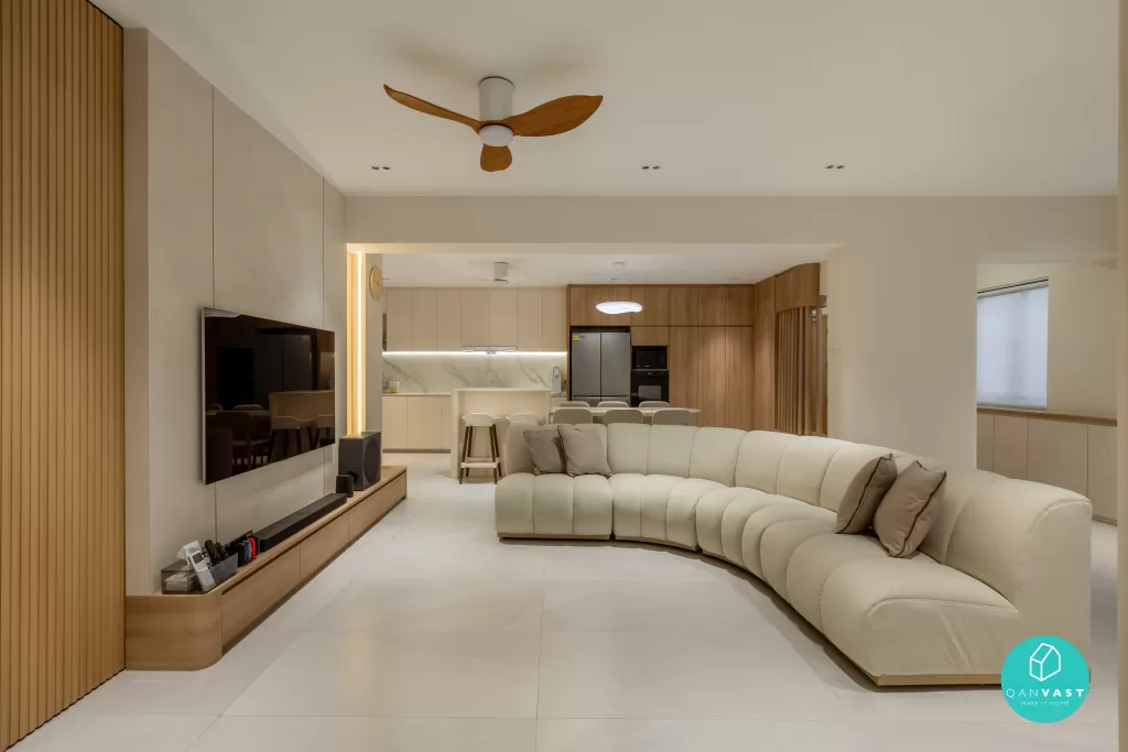 Open-concept Scandinavian living room and kitchen with curved sofa, breakfast bar, and wooden media console – functional design at 619 Ang Mo Kio Ave 4, Singapore