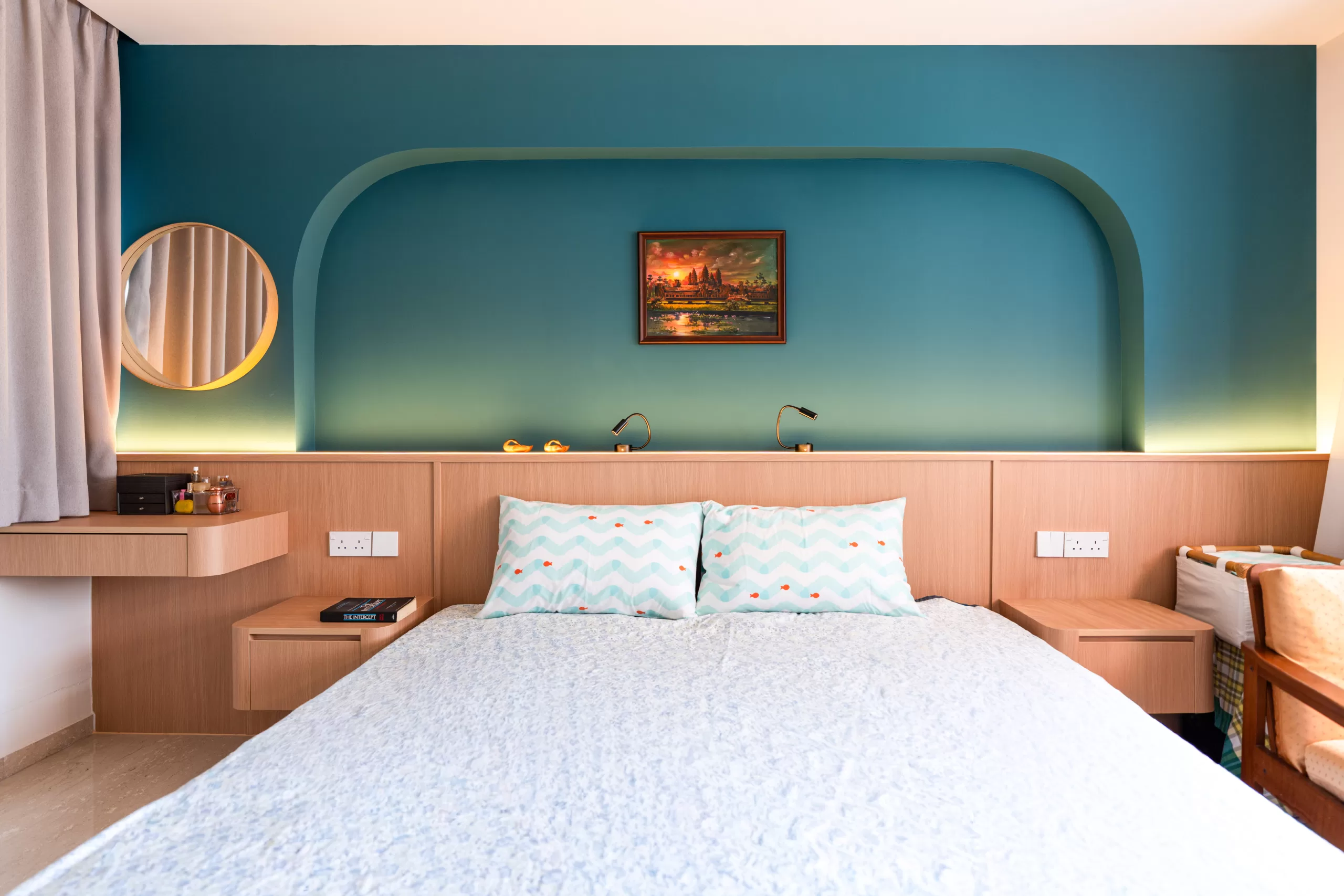 Japandi master bedroom with wooden integrated headboard, recessed teal gradient arch wall design, and ambient lighting for a serene, hotel-like retreat.