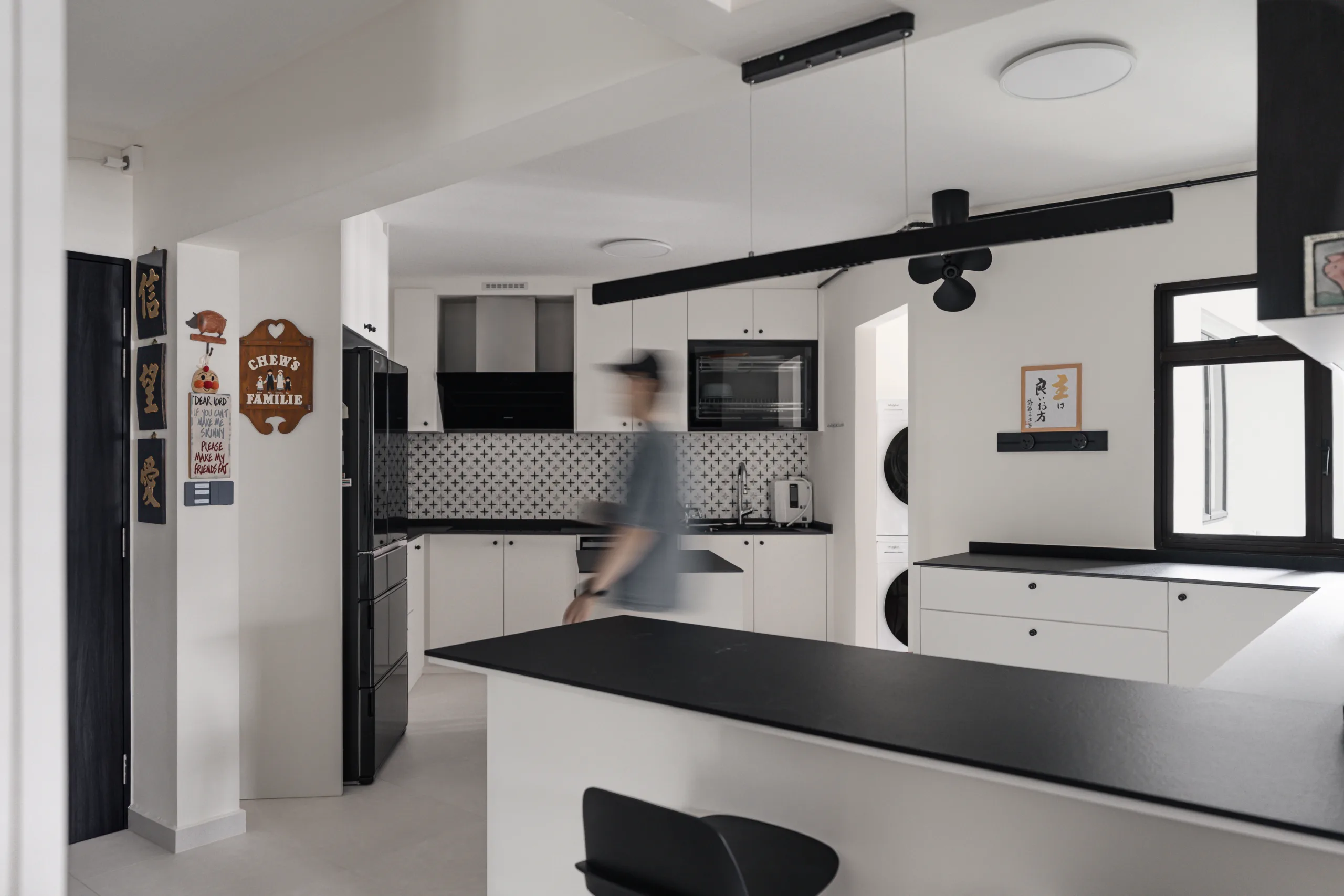 Open-plan kitchen and dining axis in a 119 sqm HDB executive apartment in Woodlands