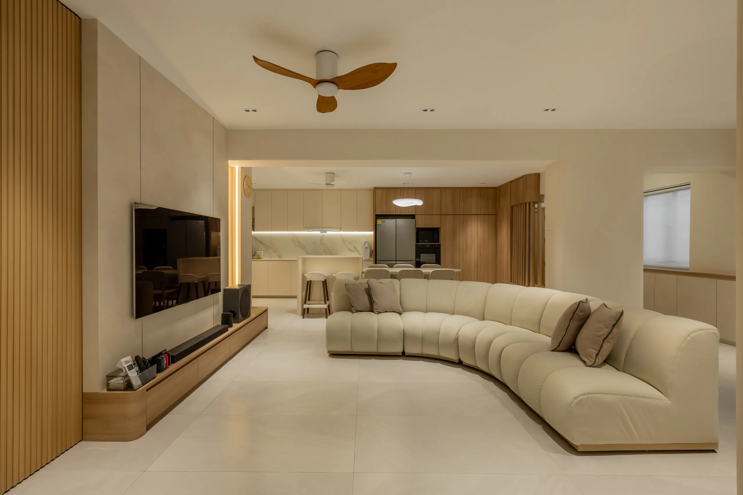 Open-concept Scandinavian living room and kitchen with curved sofa, breakfast bar, and wooden media console – functional design at 619 Ang Mo Kio Ave 4, Singapore
